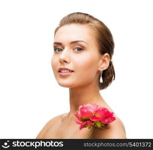 beauty and jewelry - woman wearing earrings with flower