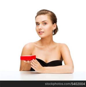 beauty and jewelry - woman with diamond earrings and gift box