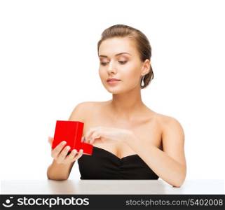 beauty and jewelry - woman with diamond earrings and gift box