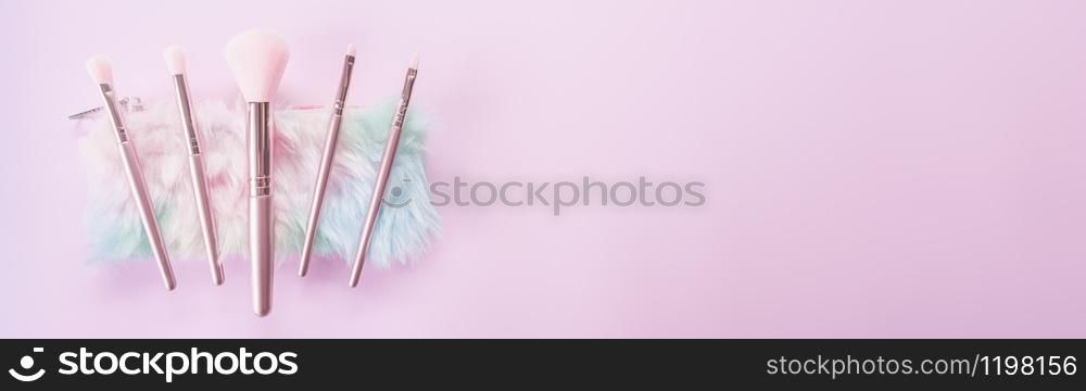 Beauty and Make up concept from Makeup tools and blush brush on pink background for Advertising sale products and Website where you place banner ads.