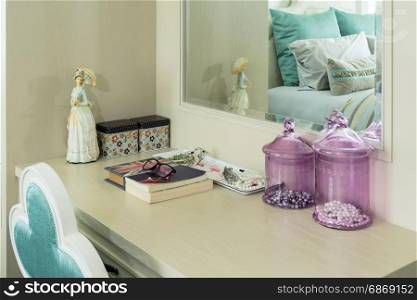 Beauty and make-up concept: mirror,jewelry and makeup set on a dressing table