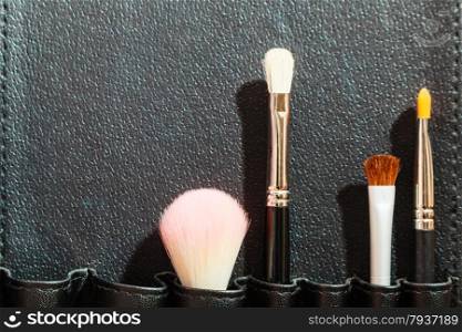 Beauty and makeup. Make up set brushes in black case background