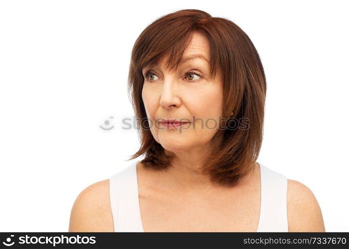beauty and old people concept - portrait of senior woman over white background. portrait of senior woman over white