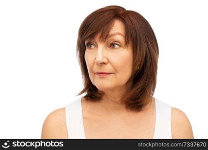 beauty and old people concept - portrait of senior woman over white background. portrait of senior woman over white