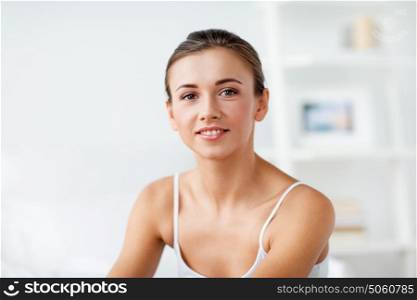 beauty and people concept - beautiful happy young woman at home. beautiful happy young woman at home