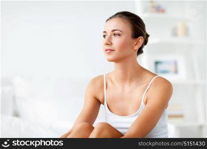 beauty and people concept - beautiful happy young woman at home. beautiful happy young woman at home