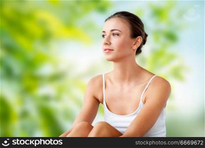 beauty and people concept - beautiful happy young woman over green natural background. beautiful happy young woman. beautiful happy young woman