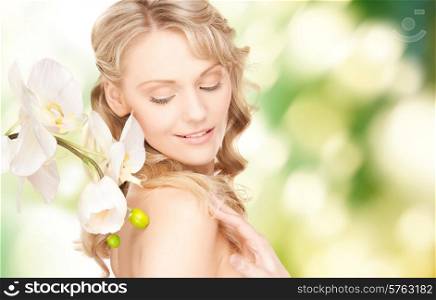 beauty and people concept - face of beautiful young woman over green background