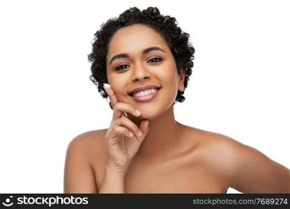 beauty and people concept - portrait of happy smiling young african american woman with moisturizer on her finger tip over white background. young african american woman with moisturizer