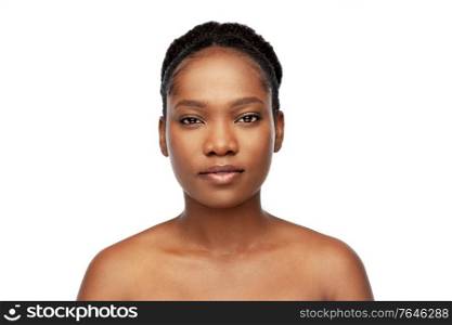 beauty and people concept - portrait of young african american woman with bare shoulders over white background. portrait of young african american woman