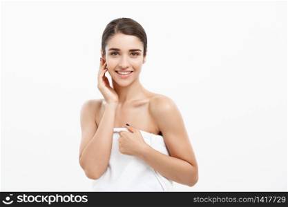 Beauty and Skin care concept -Beautiful caucasian young woman wearing towel after shower.. Beauty and Skin care concept -Beautiful caucasian young woman wearing towel after shower