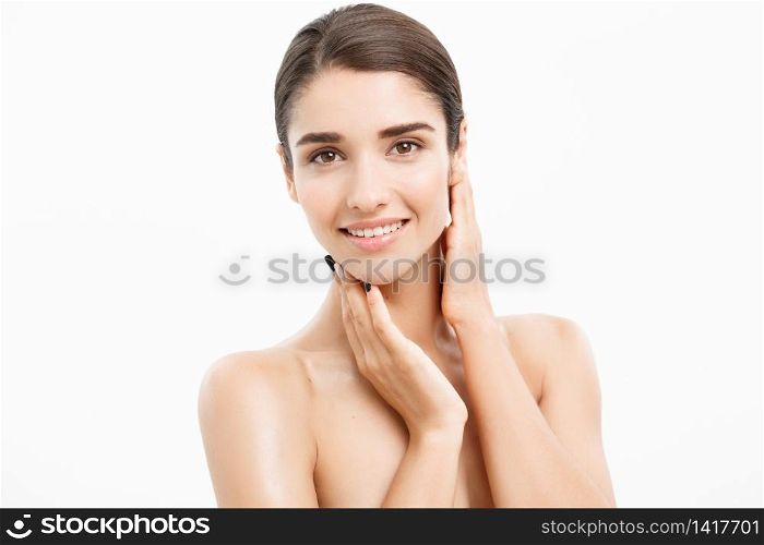 Beauty and Skin care concept - Close up Beautiful Young Woman touching her skin on white background. Beauty and Skin care concept - Close up Beautiful Young Woman touching her skin on white background.