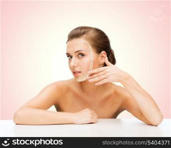 beauty and skin care concept - face of beautiful woman with lines