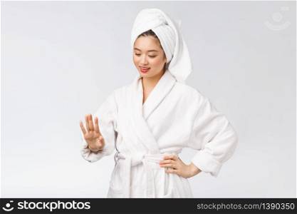 beauty asian girl who checks her skin. skin care. Isolated over white background. beauty asian girl who checks her skin. skin care. Isolated over white background.