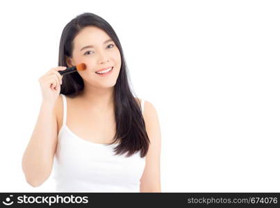 Beauty asian woman applying make up with brush of cheek isolated on white background, beautiful of girl holding blusher, skincare and cosmetic concept.