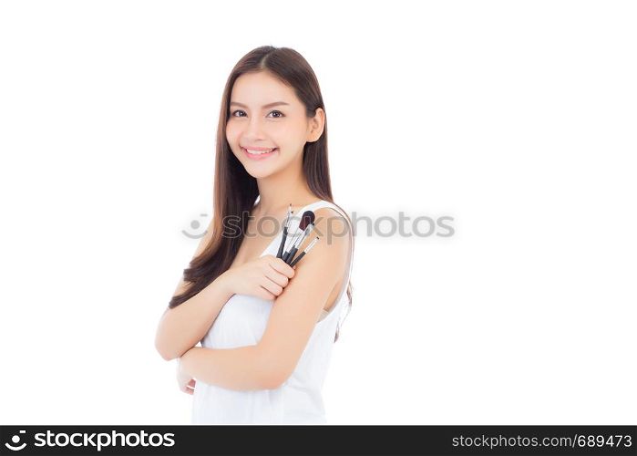 Beauty asian woman applying make up with brush on hand isolated on white background, beautiful of girl holding blusher, skincare and cosmetic concept.