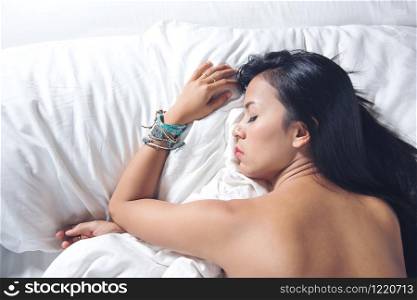 beauty asian woman black hair sleeping on white color pillow and the bed.