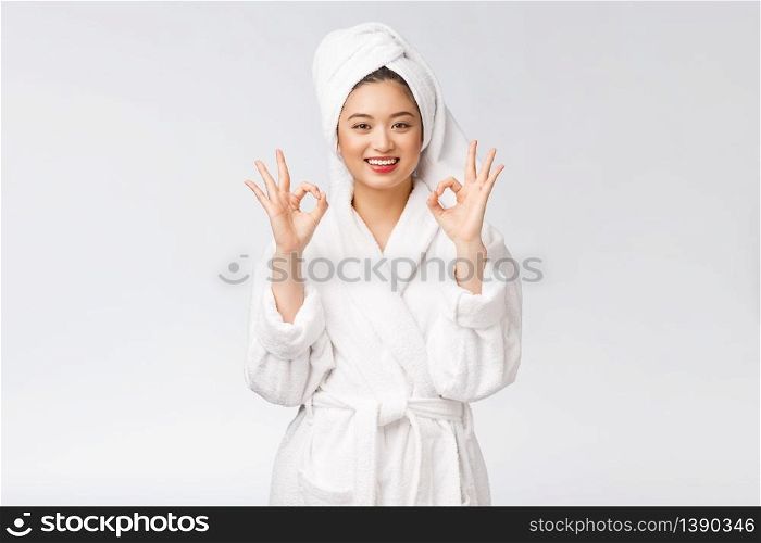 beauty asian woman ok gesture for good facial product. isolated on white background. beauty and fashion concept. beauty asian woman ok gesture for good facial product. isolated on white background. beauty and fashion concept.