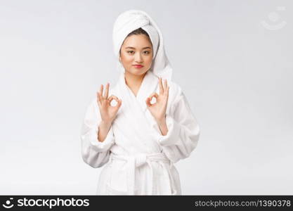 beauty asian woman ok gesture for good facial product. isolated on white background. beauty and fashion concept. beauty asian woman ok gesture for good facial product. isolated on white background. beauty and fashion concept.