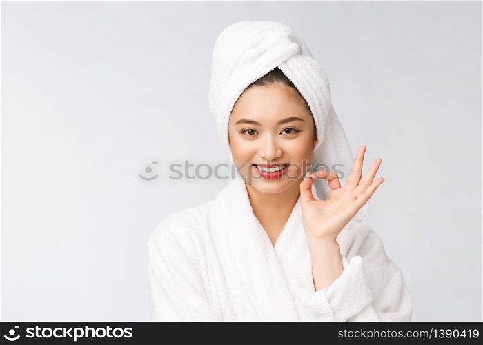beauty asian woman ok gesture for good facial product. isolated on white background. beauty and fashion concept. beauty asian woman ok gesture for good facial product. isolated on white background. beauty and fashion concept.