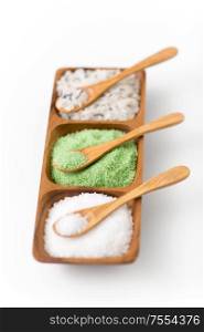 beauty, bath and wellness concept - sea salt and spoon on wooden tray. sea salt and spoons on wooden tray