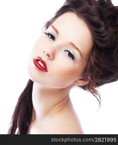 Beauty. Beautiful woman face with chic red lips close up. Bright makeup. Hairstyle