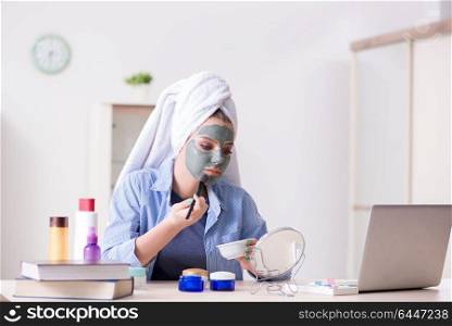 Beauty blogger applying mask and posting to internet blog