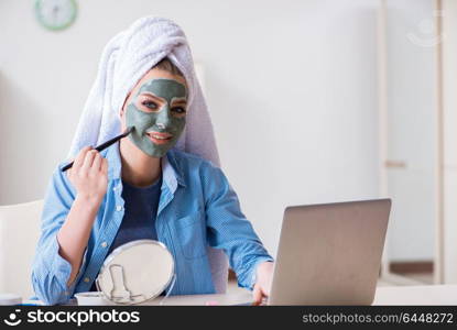 Beauty blogger applying mask and posting to internet blog