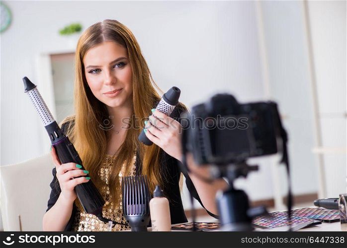 Beauty blogger filing video for her blog or vlog