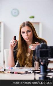 Beauty blogger filing video for her blog or vlog