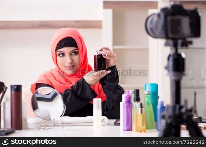 Beauty blogger in hijab recording video for her blog 