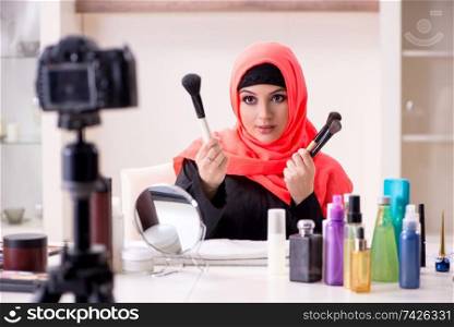 Beauty blogger in hijab recording video for her blog 