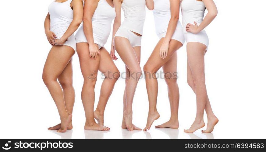 beauty, body positive and people concept - group of happy diverse women in white underwear. group of happy diverse women in white underwear