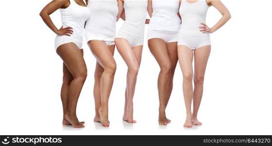 beauty, body positive and people concept - group of happy diverse women in white underwear. group of happy diverse women in white underwear