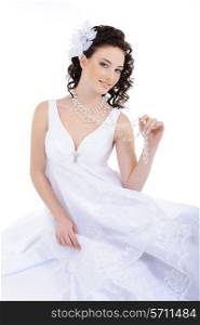 Beauty bride in white wedding dress with curly hairs