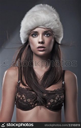 Beauty brunette in white hat