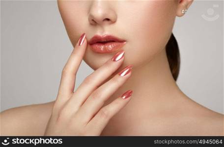 Beauty brunette woman with perfect makeup. Glamour girl. Red lips and nails. Skin care foundation. Beauty girls face isolated on light background. Fashion photo