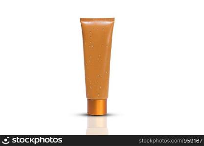 Beauty care cream or gel plastic package with water drops on white background,Blank orange cosmetic tube design mockup
