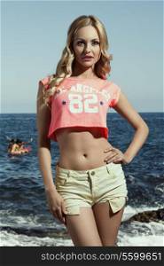 beauty casual woman with long wavy blonde hair and summer clothes wearing american top and sexy shorts