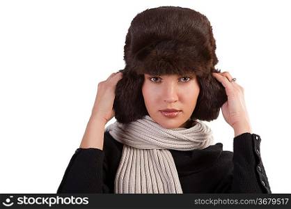 beauty close up portrait of cute female woman with fashion fur hat in winter dress with scarf against white background