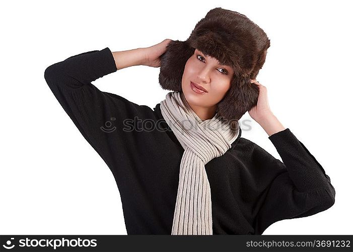 beauty close up portrait of cute female woman with fashion fur hat in winter dress with scarf standing with fun pose against white background