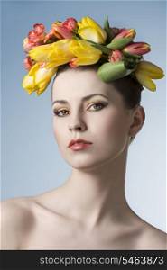 beauty close-up portrait of cute girl with floral garland on her head, cute make-up and perfect skin. Spring concept