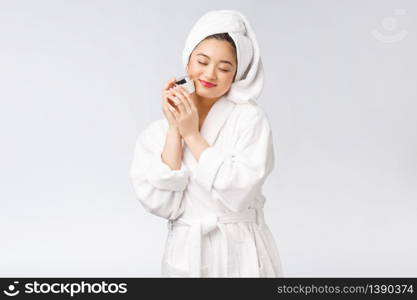 Beauty concept. Asian pretty woman with perfect skin holding cosmetic bottle. Beauty concept. Asian pretty woman with perfect skin holding cosmetic bottle.