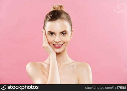 Beauty Concept - Beautiful Woman with Clean Fresh Skin close up on pink studio. Skin care face. Cosmetology. Beauty Concept - Beautiful Woman with Clean Fresh Skin close up on pink studio. Skin care face. Cosmetology.