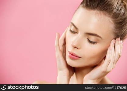 Beauty Concept - Beautiful Woman with Clean Fresh Skin close up on pink studio. Skin care face. Cosmetology. Beauty Concept - Beautiful Woman with Clean Fresh Skin close up on pink studio. Skin care face. Cosmetology.