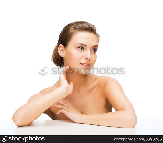 beauty concept - face and hands of beautiful woman with clean perfect skin