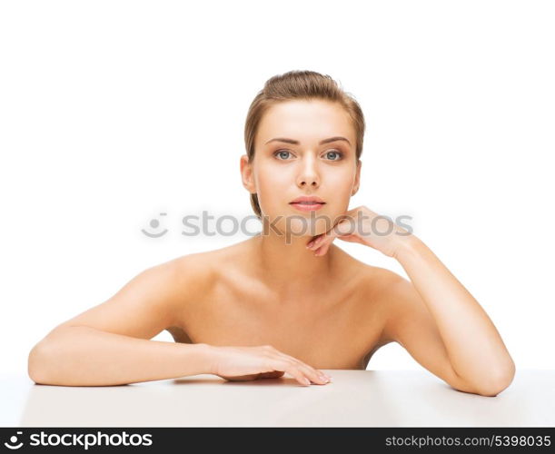 beauty concept - face and hands of beautiful woman with clean perfect skin