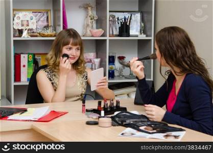 Beauty Consultants offers cosmetics client in the office