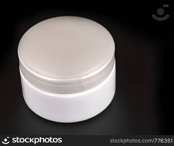 Beauty Cream Containers on Black Background