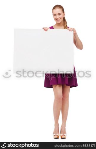 beauty, fashion, advertising and happy people concept - young woman in purple dress and high heels with white blank board
